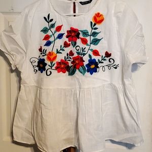 Mexican embroidered blouse .